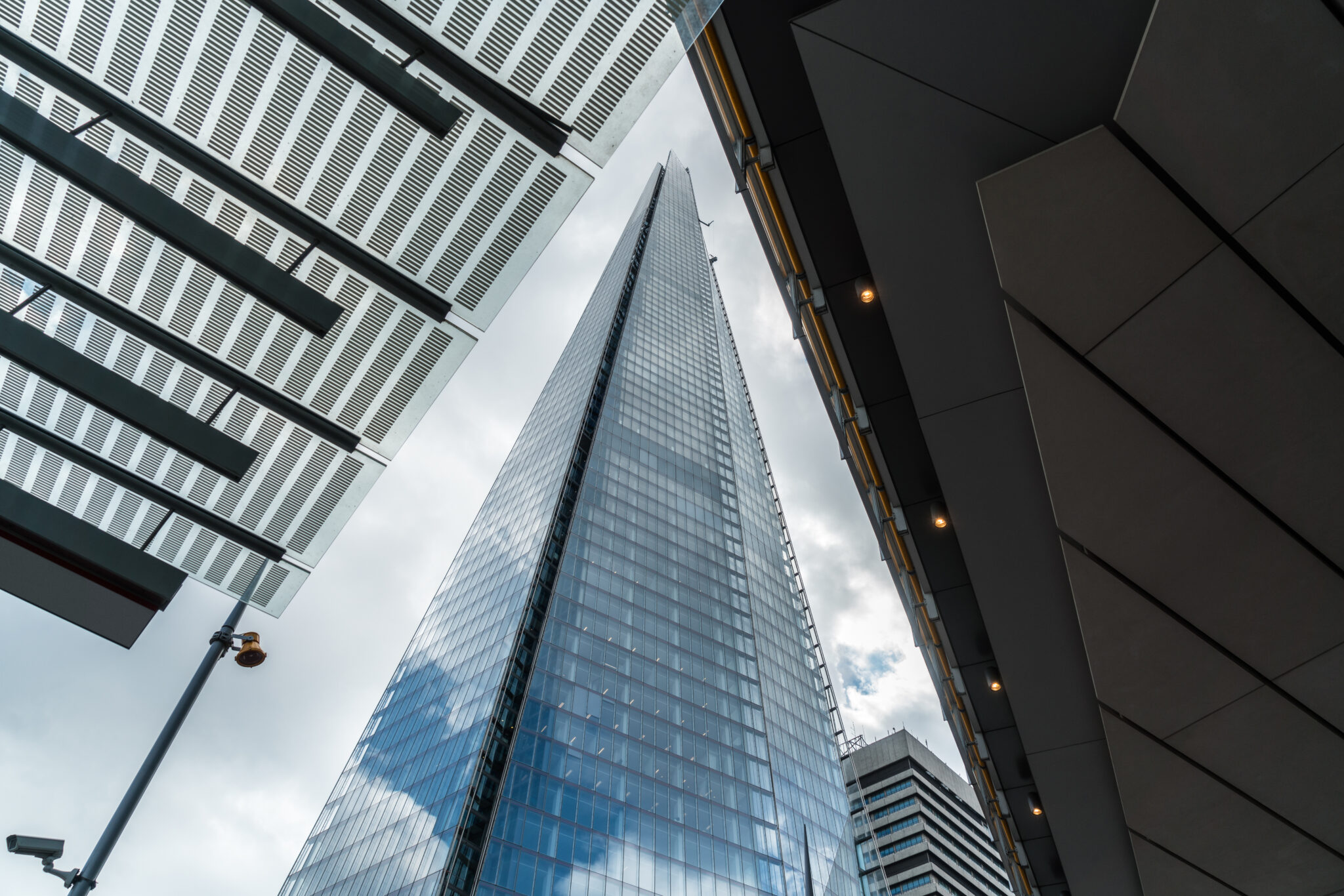 Glass and steel buildings exterior against sky. horizontal compoisition.
